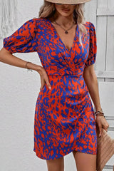 Virella – Bold Wrap Mini Dress